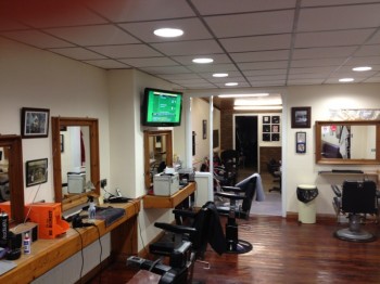 Wallmounted TV in barber's shop fitted by 1st Aerial Installations & Services,Falls Road, Belfast, Northern Ireland